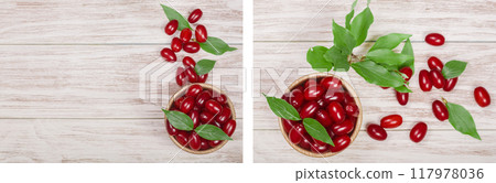 dogwood berry with leaf in bowl on white wooden background with copy space for your text. Top view dogwood berry with leaf in bowl on white wooden background with copy space for your text. Top view 117978036