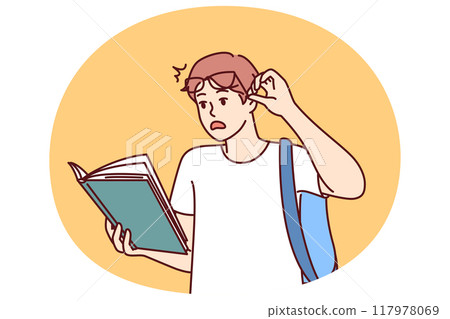 Shocked guy student with book reads amazing smart facts in textbook which causes wow effect Shocked guy student with book reads amazing smart facts in textbook which causes wow effect 117978069