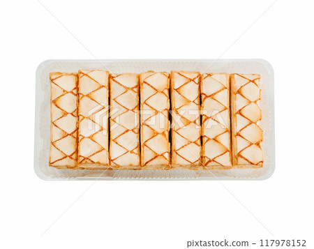 Italian crispy sweet bakery Sfogliatine glassate isolated on white background. Tasty cookies with apricot glaze puff pastries in container. Top view. 117978152