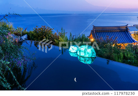 Japanese  garden in Crimea Ukraine (now occupied byRussia) with rocks reflecting in water 117978230
