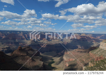 The Grand Canyon, a landscape created by nature over many years and with a blue sky and a vast expanse The Grand Canyon, a landscape created by nature over many years and with a blue sky and a vast expanse 117978244