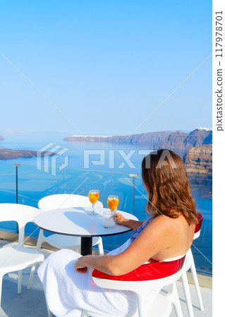 Woman relaxing near pool 117978701