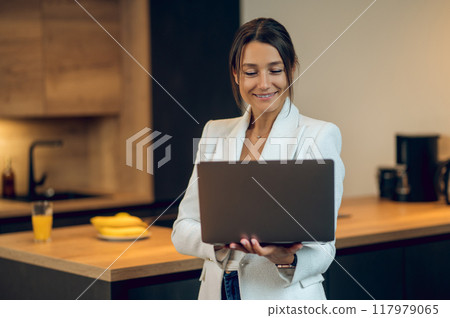 Pretty business woman in white jacket looking confident and determined 117979065