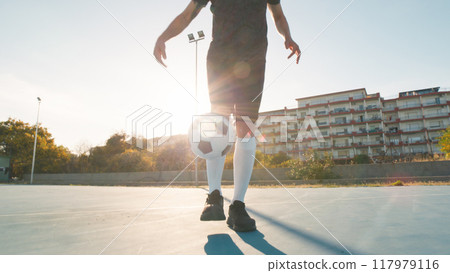 Boy Doing Creative And Playful Air Dribbling  117979116