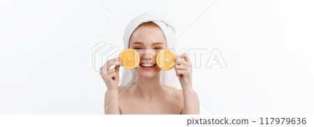 Great food for a healthy lifestyle. Beautiful young shirtless woman holding piece of orange standing against white background. Great food for a healthy lifestyle. Beautiful young shirtless woman holding piece of orange standing against white background. 117979636