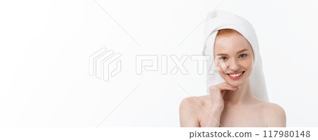 Surprised Beautiful Young Woman After Bath with A Towel On Her Head Isolated On white Background. Skin Care And Spa Theme. 117980148
