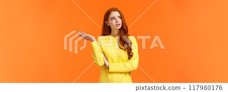 Troubled and unsure, indecisive cute redhead girl trying solve problem, searching resolve, looking perplexed upper left corner pondering, raise hand uncertain, confused, shrugging, orange background Troubled and unsure, indecisive cute redhead girl trying solve problem, searching resolve, looking perplexed upper left corner pondering, raise hand uncertain, confused, shrugging, orange background 117980176
