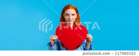 Showing my affection. Valentines day concept. Confident and bold cute redhead woman in nightwear holding huge heart gesture and smiling, expressing love and admiration, confessing Showing my affection. Valentines day concept. Confident and bold cute redhead woman in nightwear holding huge heart gesture and smiling, expressing love and admiration, confessing 117980183