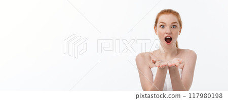 Skin care beauty woman showing empty palm with copy space for product. Excited smiling Caucasian female beauty model isolated on white background. 117980198