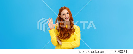 Cheerful, charismatic friendly redhead female showing high five, number fifth as making order, reservation or booking place for party, counting, standing blue background carefree in yellow sweater 117980213