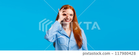 Excellent choice right here. Charismatic satisfied redhead female in nightwear showing okay gesture, promote beauty products, dont worry about menstrual period, standing blue background Excellent choice right here. Charismatic satisfied redhead female in nightwear showing okay gesture, promote beauty products, dont worry about menstrual period, standing blue background 117980428