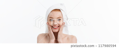Surprised Beautiful Young Woman After Bath with A Towel On Her Head Isolated On white Background. Skin Care And Spa Theme. 117980594