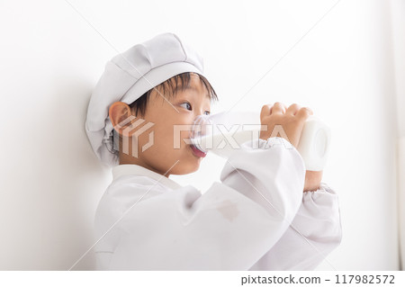 Boy drinking milk Boy drinking milk 117982572