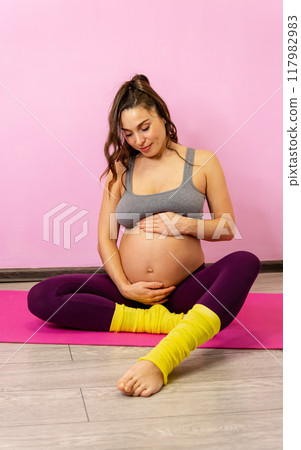 5A glowing pregnant woman enjoys a moment of tranquility 5A glowing pregnant woman enjoys a moment of tranquility 117982983