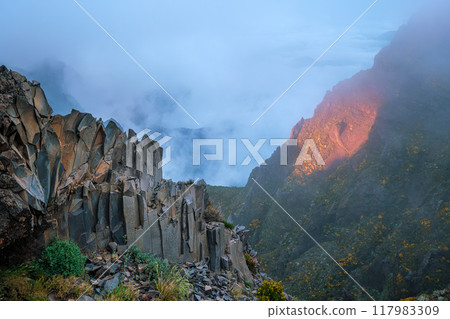 Mountains on sunset covered in fog and clouds. Madeira island, Portugal Mountains on sunset covered in fog and clouds. Madeira island, Portugal 117983309