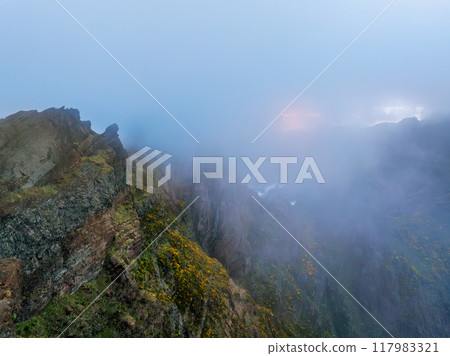 A mountain covered in fog and clouds. Madeira island, Portugal 117983321