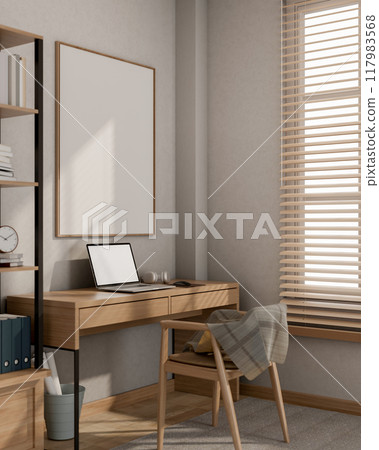 A minimalist Scandinavian home office workspace features a laptop on a wooden desk against the wall. 117983568