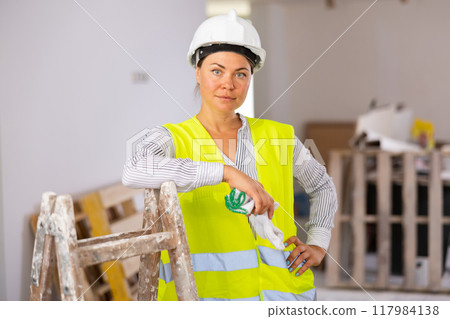 Portrait of a young woman engineer in uniform 117984138