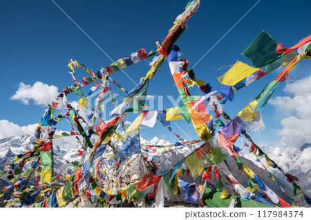Prayer flags pole on the top of Tsergo Ri (4,990m) the high point on the Langtang valley trek of Nepal. 117984374