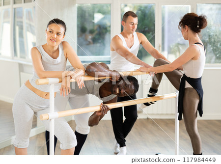 Men and women communicate with each other during break between classes ballet in choreographic studio 117984449