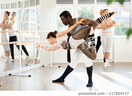 Adult man and adult woman rehearsing pair ballet 117984537