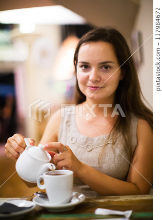 Young girl rests in cafe Young girl rests in cafe 117984672