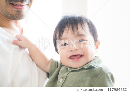 Close-up of cute baby smiling looking at camera 117984882