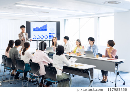 Male and female engineers having a meeting Male and female engineers having a meeting 117985866