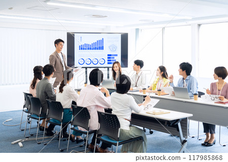 Male and female engineers having a meeting Male and female engineers having a meeting 117985868