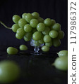 Beautiful fresh Shine Muscat grapes on a glass container, vertical composition 117986372