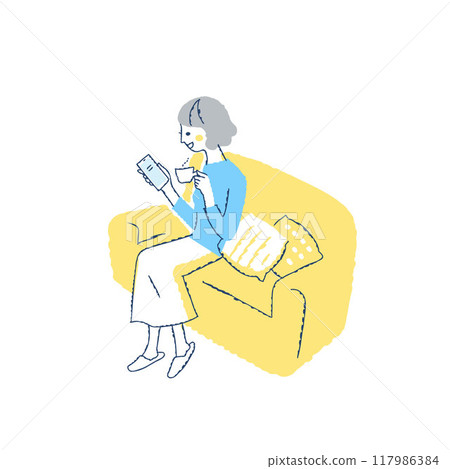 Smiling woman sitting on sofa and looking at smartphone 117986384