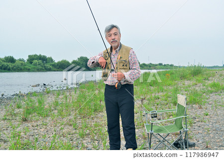 Veteran fly fishing angler 117986947