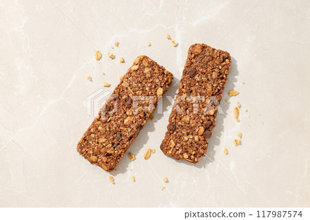 Delicious granola bars on a white background 117987574