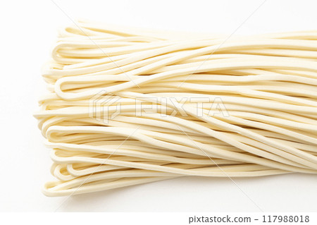 Semi-cooked udon noodles on white background 117988018