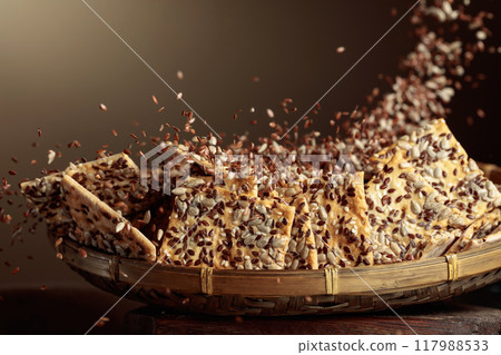 Crackers with sunflower seeds and flax seeds. 117988533