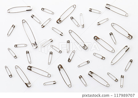 Set of big and small size silver safety pins. Set of big and small size silver safety pins. 117989707