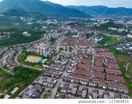 Aerial view of residential houses and driveways neighborhood during a fall sunset or sunrise time.Tightly packed homes.Top view over building houses in phuket thailand Aerial view of residential houses and driveways neighborhood during a fall sunset or sunrise time.Tightly packed homes.Top view over building houses in phuket thailand 117989915