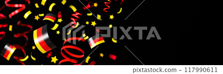 Dynamic festive scene featuring confetti, streamers, and stars in colors of the German flag against a dark background, ideal for celebrations and German national events. Banner with copy space. 3D. Dynamic festive scene featuring confetti, streamers, and stars in colors of the German flag against a dark background, ideal for celebrations and German national events. Banner with copy space. 3D. 117990611