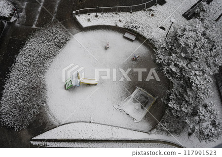 A small park covered in snow A small park covered in snow 117991523