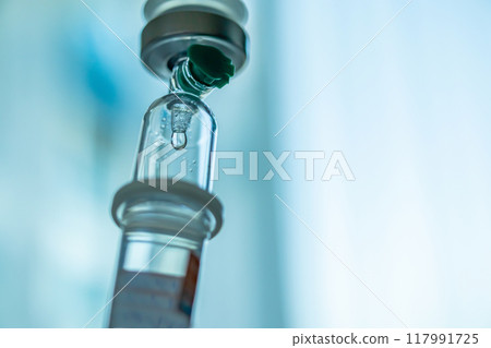 Close up medical intravenous IV drip in hospital background 117991725
