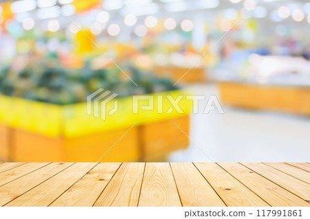Empty wood table top with supermarket blurred background for product display Empty wood table top with supermarket blurred background for product display 117991861