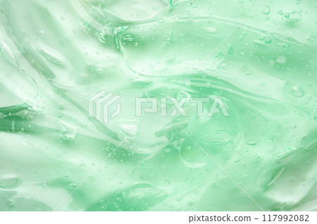 Transparent clear green liquid serum gel cosmetic texture background Transparent clear green liquid serum gel cosmetic texture background 117992082