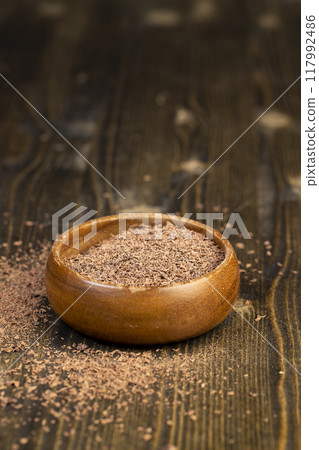 round wooden bowl with chocolate pieces and chips round wooden bowl with chocolate pieces and chips 117992486