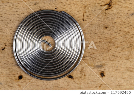 twisted like a spring solder for repair work with soldering twisted like a spring solder for repair work with soldering 117992490