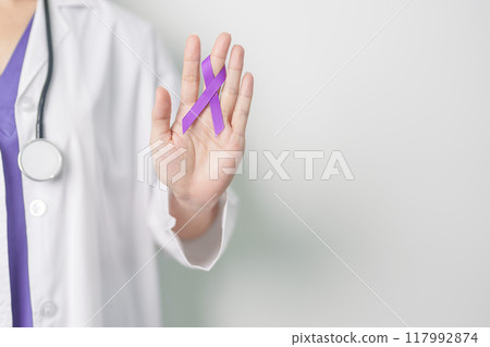 Doctor holding purple Ribbon for Violence, Pancreatic, Esophageal, Testicular cancer, Alzheimer, epilepsy, lupus, Sarcoidosis and Fibromyalgia. Awareness month and World cancer day concept 117992874