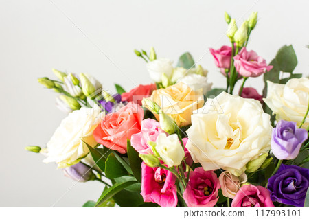 Celebrate special occasions with a colorful summer bouquet featuring fresh roses, eucalyptus, and eustoma blooms, creating an elegant and fragrant floral arrangement Celebrate special occasions with a colorful summer bouquet featuring fresh roses, eucalyptus, and eustoma blooms, creating an elegant and fragrant floral arrangement 117993101