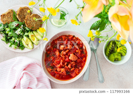 Red soup with beet, vegetables and cauliflower, chickpea cutlets and mixed salad 117993166