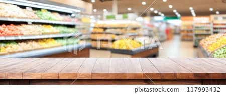 Wooden tabletop for product placement, grocery store backdrop, empty retail space, presenting products, supermarkets or retail stores, clear and clean wooden counter, unoccupied retail shelf in store 117993432