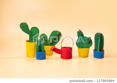 a group of cactus plants sitting next to each other, conceptual art, toy design, on a yellow canva, product photo, 117993864
