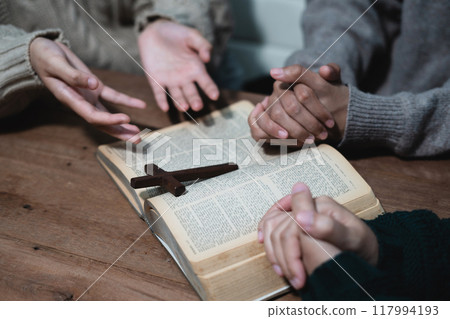 Asian men and women hands praying to god with the bible. Pray for god blessing. Religious beliefs Christian life crisis prayer to god. 117994193